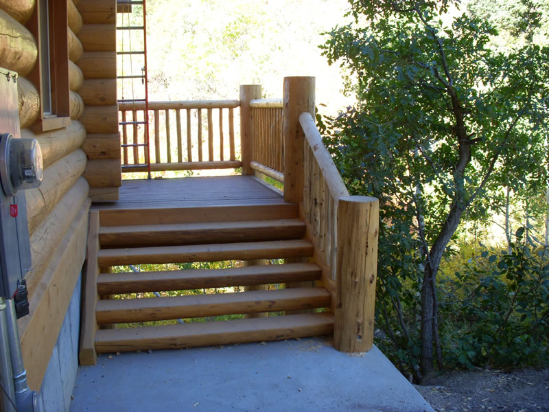log stairs west porch